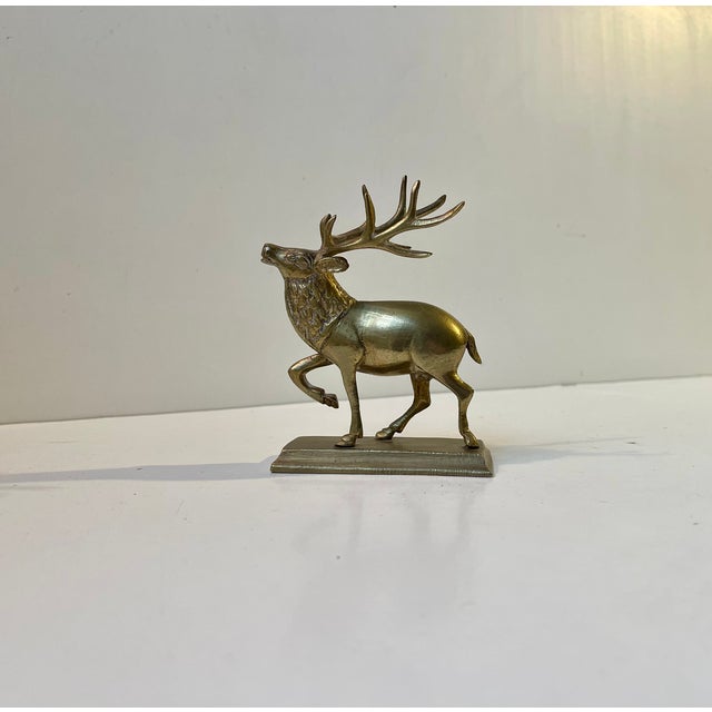 A well made solid brass figurine or small sculpture of a Deer. It certainly has some age to it but otherwise we do not...
