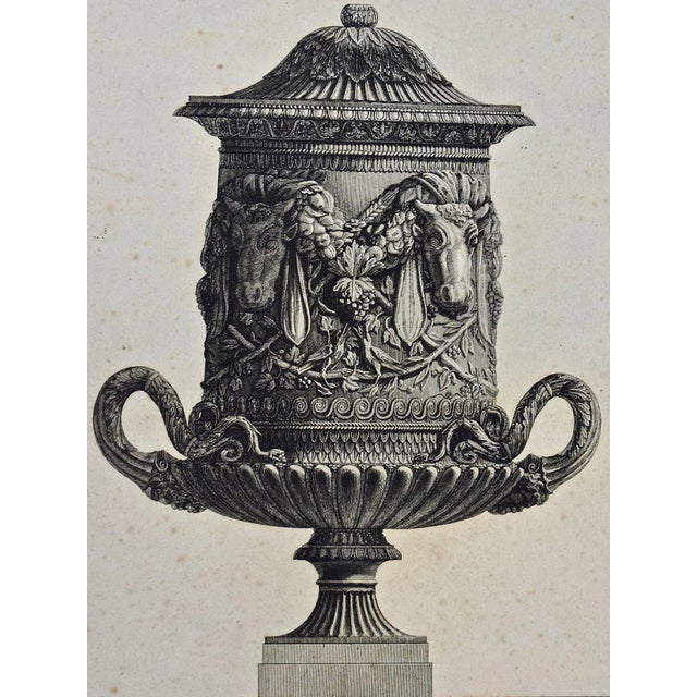 "Vaso Cinerario di Gran Mole. Le Teste dei Giovenchi mostrano di reggere it pesante Festone composto di Frutti Fiori Grans...