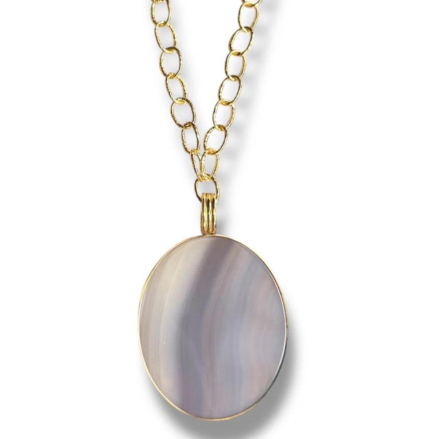 Oversized Gold pendent enhancer, featuring tonal hues of Agate Pendent is an enhancer with a bale that can be worn on any...