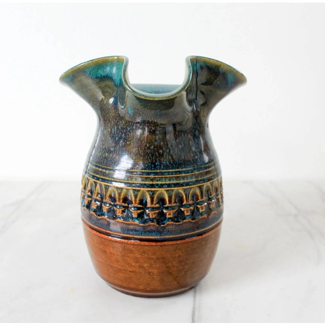 Vintage studio art glazed pottery pitcher. Signed by artist on bottom. Minimal signs of wear. No chips.