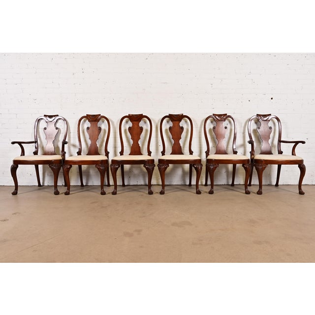 A gorgeous set of six Queen Anne or Georgian style dining chairs By Baker Furniture USA, Circa 1980s Solid carved mahogany...