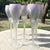 An elegant set of vintage Reuven wine glasses showcasing a refined Art Nouveau influence with softly tapered silhouettes...
