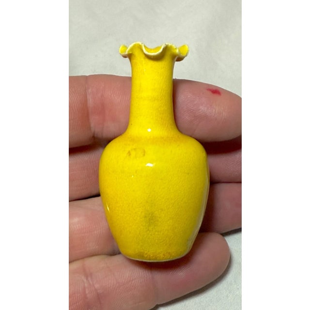 This antique miniature 19th century Chinese yellow glaze pottery vase is a rare and unique piece that showcases the...