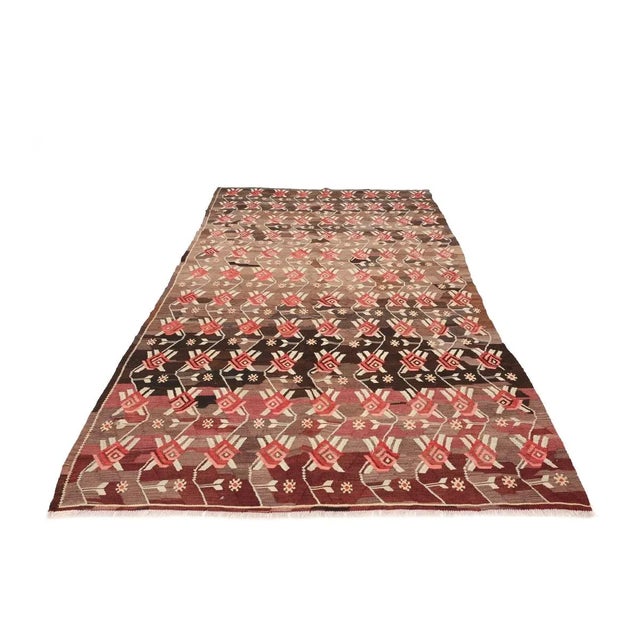 Vintage handwoven decorative kilim rug from Kars region of Turkey. Approximately 50-60 years old. In very good condition.