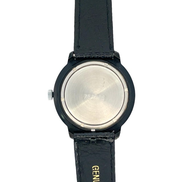 Vintage Raketa manual wind wristwatch featuring a silver & black finished steel case. Case size measures approx. 1.3"....