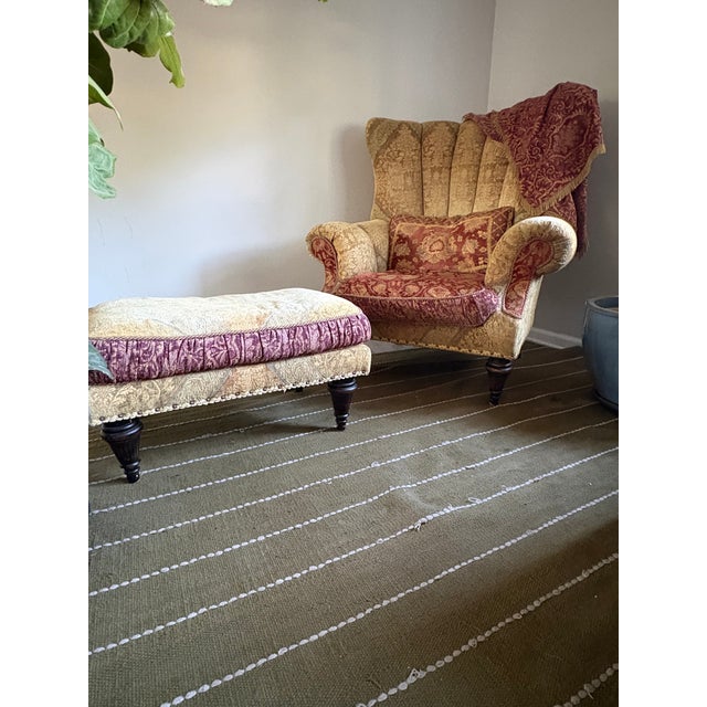 Oversized Armchair with matching ottoman. Curved back with outward rolled arms centering a stuffed seat, noncircular-...