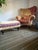 Oversized Armchair with matching ottoman. Curved back with outward rolled arms centering a stuffed seat, noncircular-...
