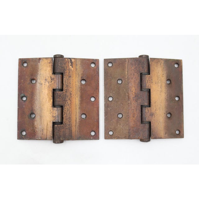 These door hinges are made of brass finish steel with flat tips, five knuckles, and a staggered hole pattern. The original...