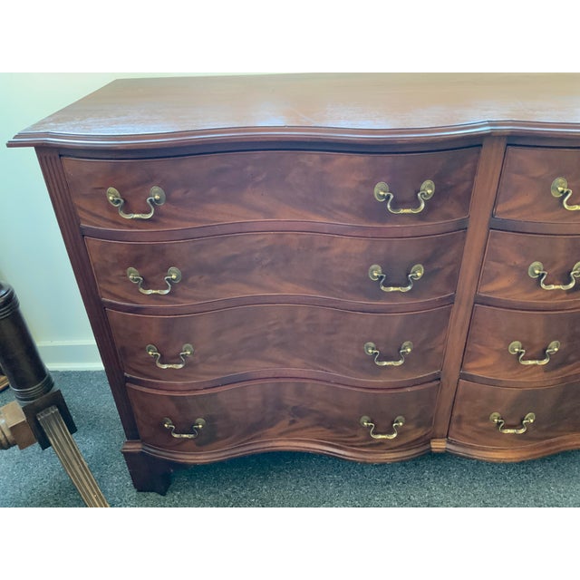 20th century serpentine front Chippendale style chest, marked Beacon Hill Collection.