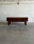 This minimalist low storage unit features a beautifully streamlined rectangular frame with thick square legs. One...