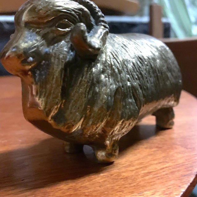 A handsome plump and squatting solid brass ram figure. Great for display and as a paperweight.