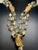 A multi four strand necklace, 21” in length with contrasting gemstones of rutile quarts and labradorite with large barrel...