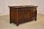 Circa 1900-1910 English Edwardian blanket chest from England. The top is paneled, and follows down to paneled sides on all...
