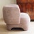 This armchair is a newly produced piece of seating furniture with a completely enclosed, voluminous body and a...