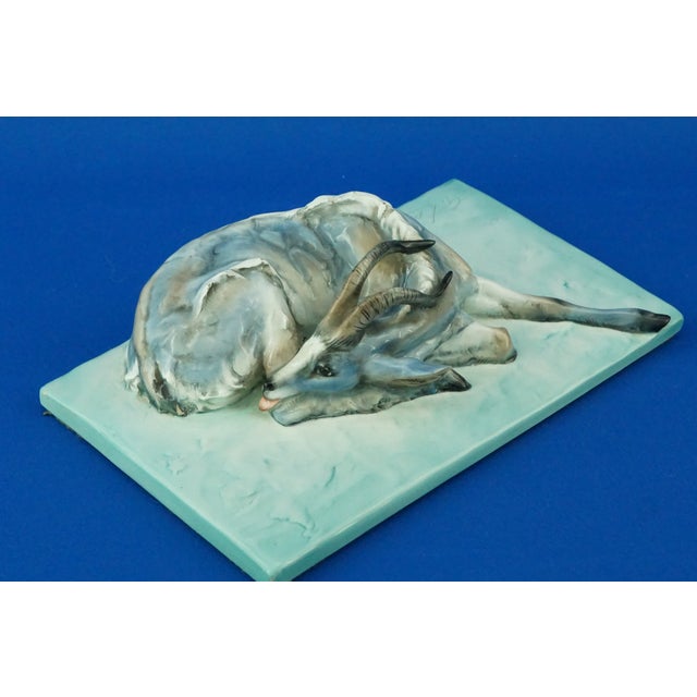 Description of the object: Sculpture depicting a reclining ibex, made of stoneware, clay slightly softened with kaolin,...