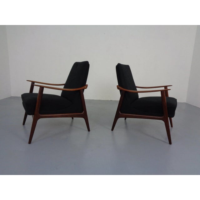 Delicate Danish teak armchair from the 1960s. Reupholstered in black.