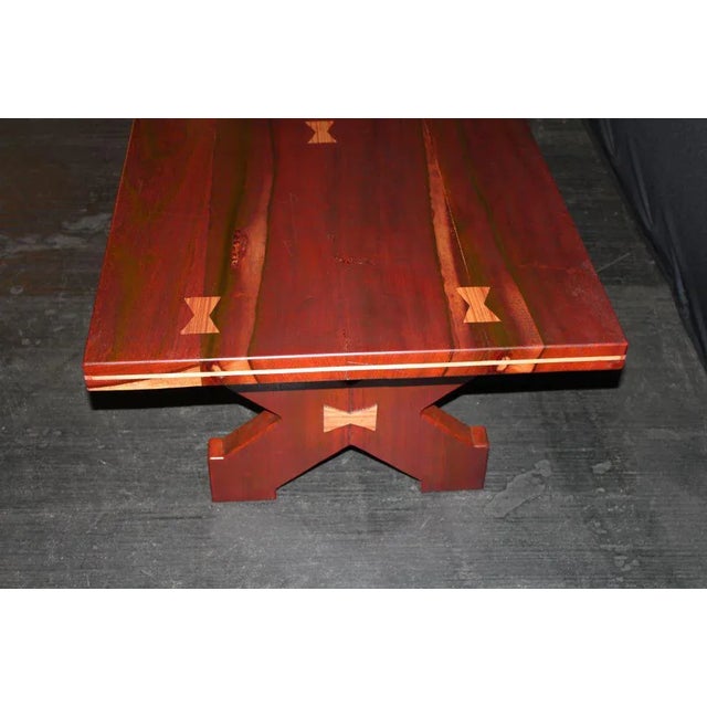 A great craftsman's table made of exotic woods with butterfly details. The wood I believe is padauk, a reddish wood and...