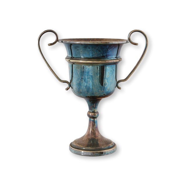 English silverplate trophy awarded to a ski champion during the 1950s. Its elegant twin handled form, engraved...