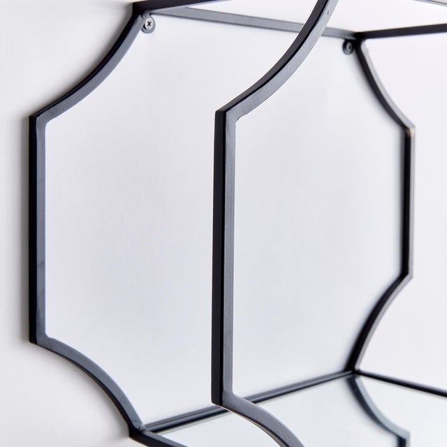 These sleek black and generously-scaled wall shelves are a dynamic design accent. With a shelf deep enough for a wide...