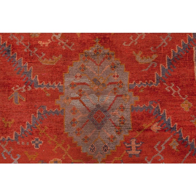 This monumental antique Turkish Oushak rug from the 1880s is a superb example of Anatolian artistry at scale. Woven in the...