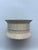 A single round spool shaped trinket box with lid featuring inlaid bone decoration. Interior 2" depth.