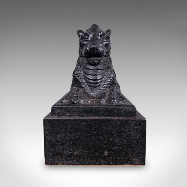 This is an antique guardian lion door keeper. An English, cast iron mythical animal doorstop, dating to the late Victorian...