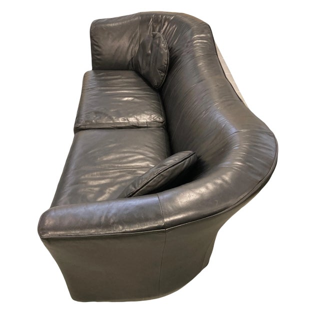 A very fine and rare custom biomorphic curved back Postmodern sofa by Jaymar in black leather. Retaining the original...