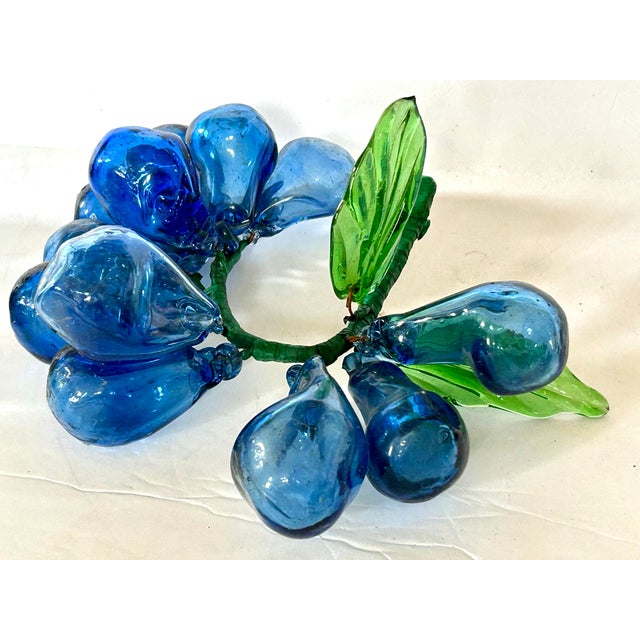 MCM Italian hand blown blue glass grapes. Set includes two large clusters. Several grapes have varying shapes and one leaf...
