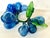 MCM Italian hand blown blue glass grapes. Set includes two large clusters. Several grapes have varying shapes and one leaf...