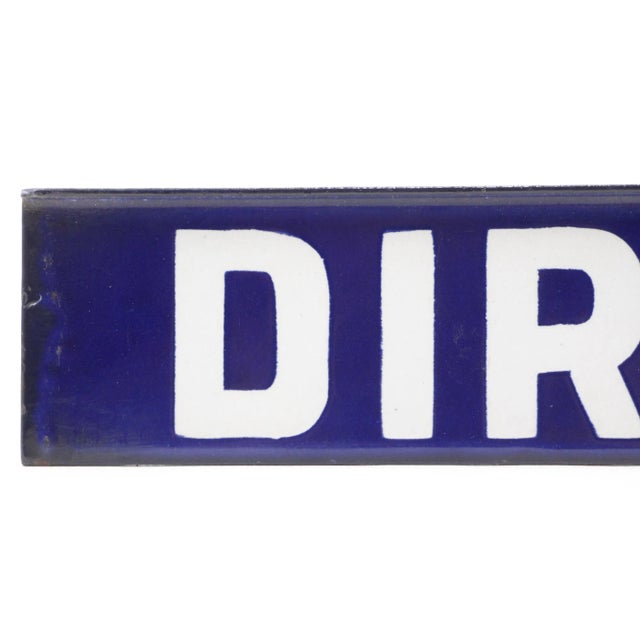 This sign reads, "Direct". This rectangular sign is made of steel with white lettering and a blue background. It features...