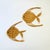 A set of 2 vintage wicker wall hangings in the shape of fish. Measurements: 9"W x 9"H x .25"D 8"W x 9"H x .25"D