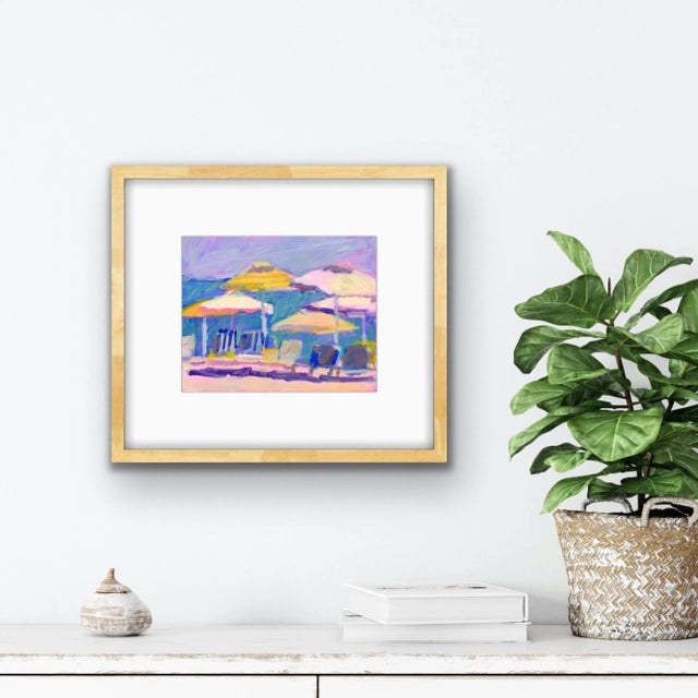 An original print of Michelle Heimann's "circle of Umbrellas #2". A beachscape showing colorful umbrellas and chairs.