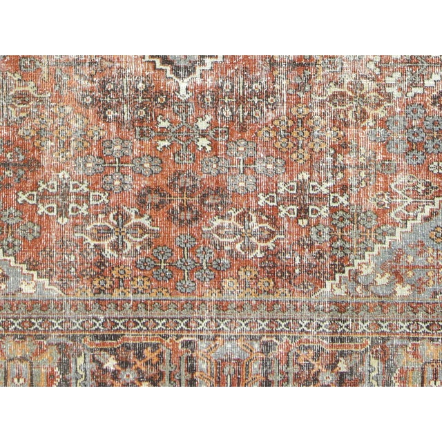 This Antique Persian Joshagan Rug comes in an elegant 9'2" x 11'8" size, made from a combination of wool and cotton for a...