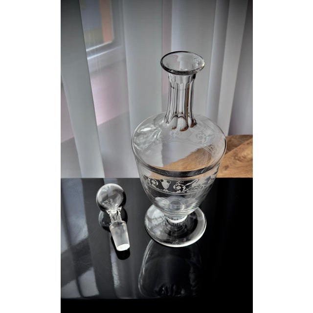 A refined French crystal decanter by Baccarat, produced for Croizet Cognac in the early 20th century. This elegant piece...