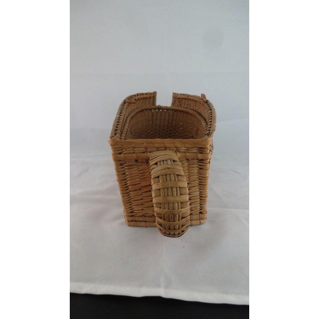 A French rattan wine bottle holder circa 1930's with a plaque that reads Bouchard Pere et Fils/Au Chateau/Beaune (Cote...