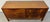 This mid-century modern walnut sideboard from the Janus Collection by John Stuart for Mount Airy Furniture features a...