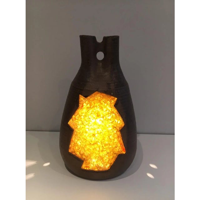 This table lamp is made of ceramic and yellow glass incrustations. This is a French Work, circa 1970.