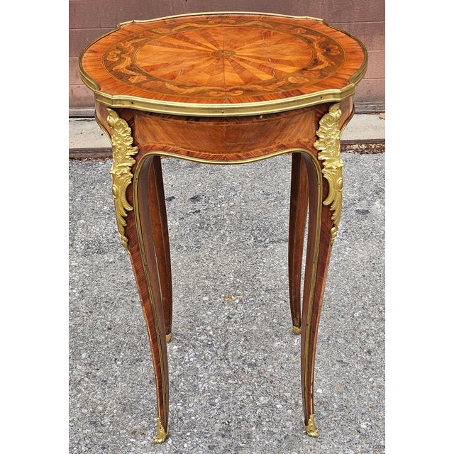 A Louis XV Style Ormolu Gilt Bronze Mounted Kingwood and Tulipwood Gueridons with impressive, clean lines marquetry works...