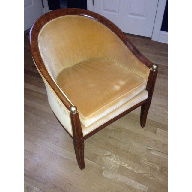 French Classic Empire style barrel back tub chair, with brass ball and carved details. Upholstery is worn. Chair is very...