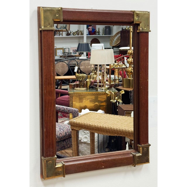 Vintage rectangular solid wood wall mirror with brass campaign bracket hardware to four corners. A versatile size and...
