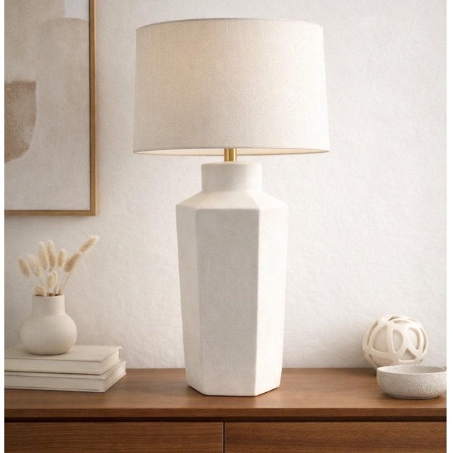 This striking vintage mid-century modern ceramic table lamp features a bold geometric faceted design in a clean white...