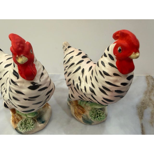 A charming pair of hand-painted bisque porcelain hen salt and pepper shakers, made in Japan in the mid-20th century. Matte...