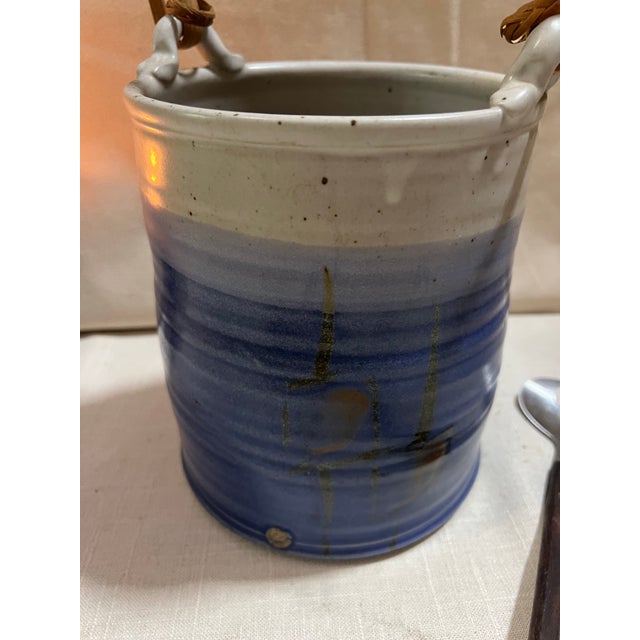 Up for consideration is a beautiful vintage blue ombré pottery bowl with a handle and matching utensil. This piece would...