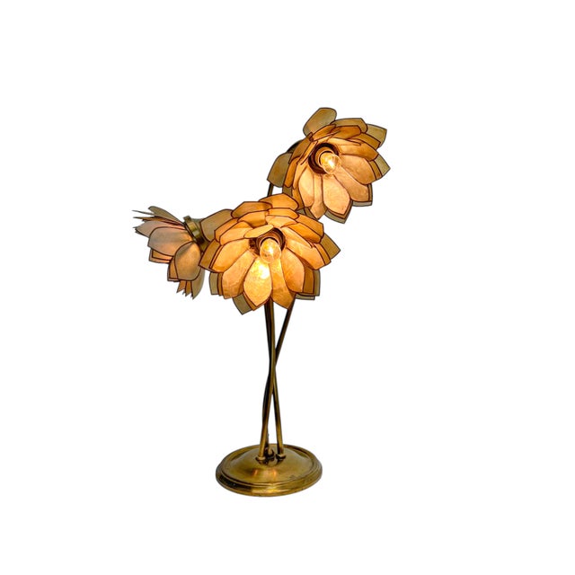 A particularly decorative and vibrant table lamp from the 1960s, featuring an elegant bouquet of three flowers on a brass-...