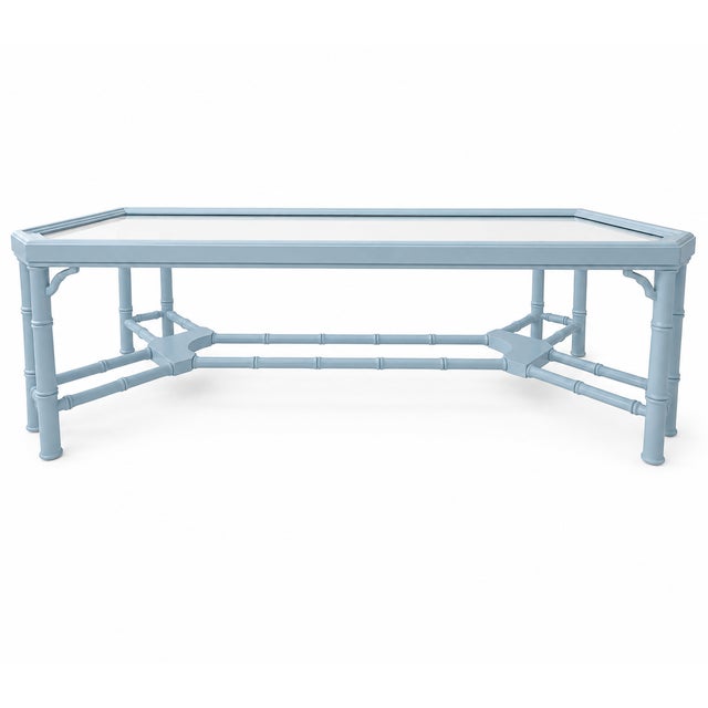 Vintage faux bamboo coffee table with inset glass top, newly refinished in Benjamin Moore Blue Hydrangea, a soft coastal...