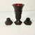This set is a vibrant Ruby Red Depression Glass Candle Holders and Vase. They feature the Diamond Point design the was...