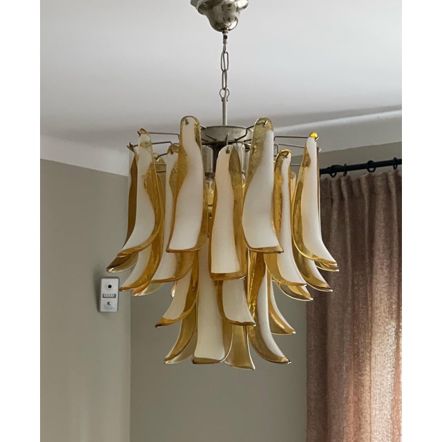 Pair of two Small Bold Eclectic Amber Colored Murano Chandeliers. Petal Formed Glass Prisms in Traditional Italian Mid-...