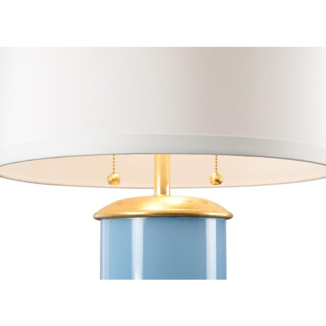 Brighten your home with this charming transitional table lamp. Savannah features a colorful glass cylinder with a dazzling...