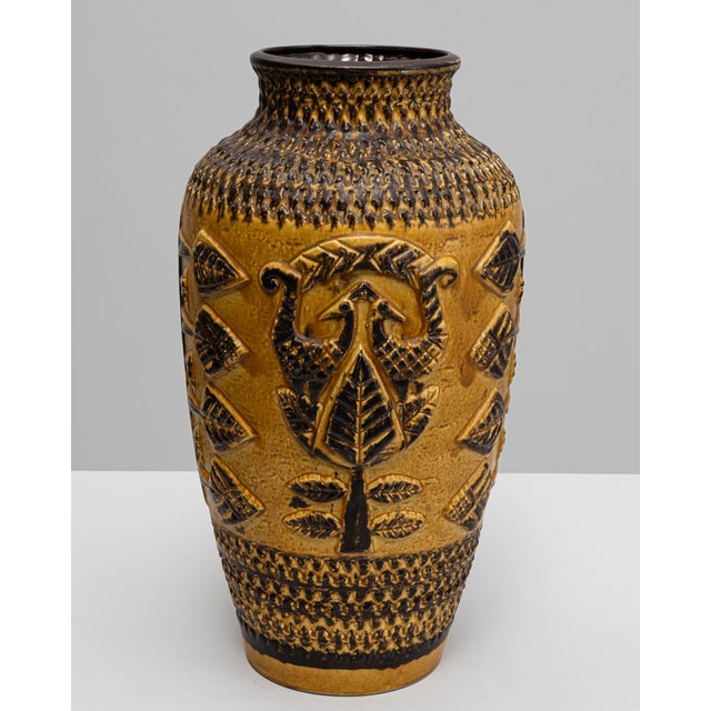 This 20th-century German ceramic vase, marked W. Germany, is a striking example of mid-century craftsmanship and design....