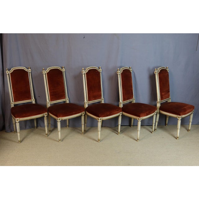 Rare set of 12 Directoire-style chairs in painted beechwood, dating from the second half of the 20th century. These chairs...